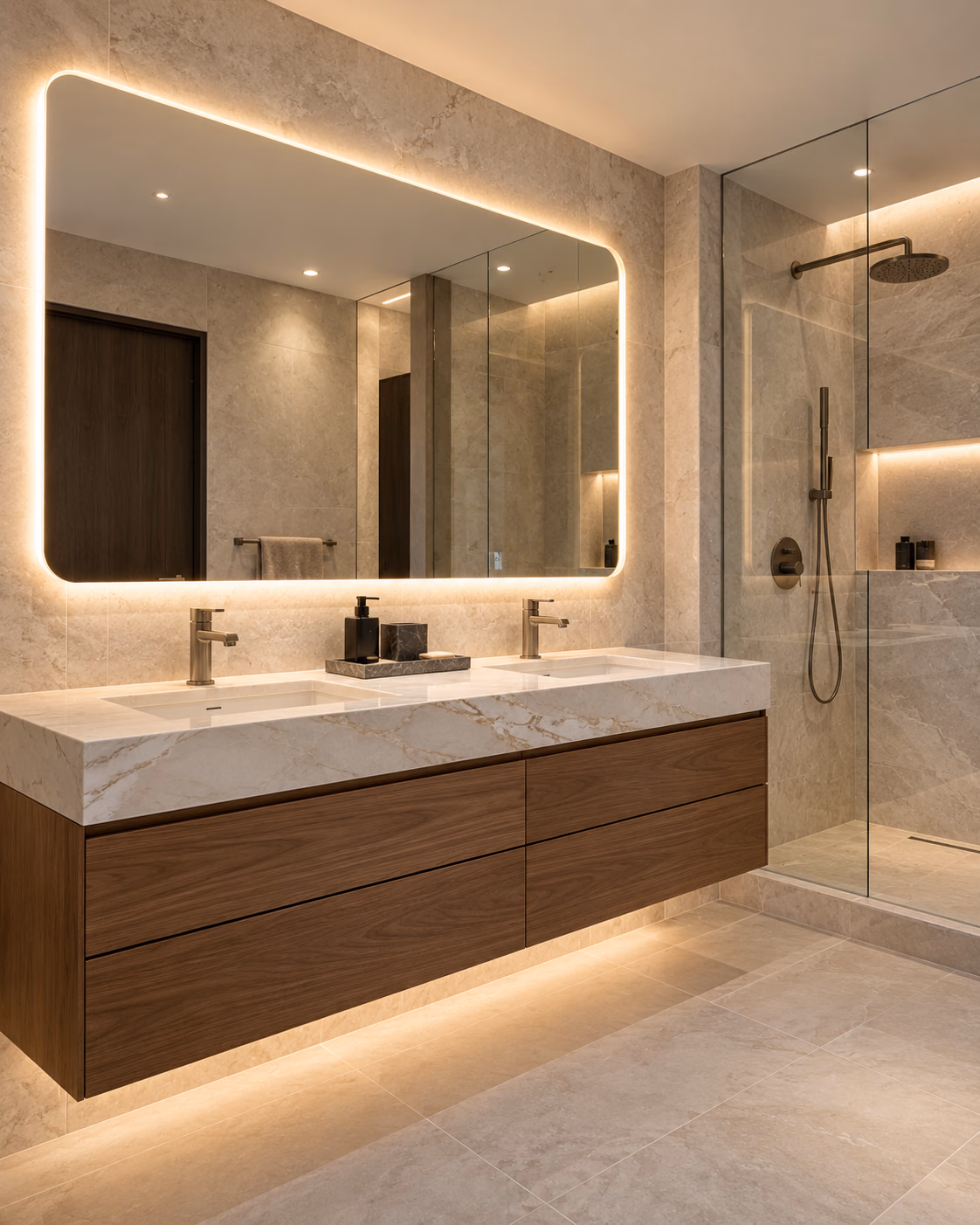 Floating walnut double vanity under a backlit mirror